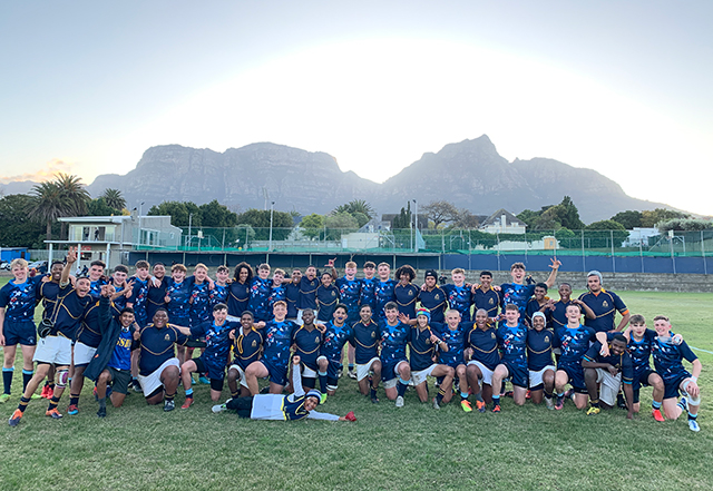 Teams gather after a rugby match in South Africa