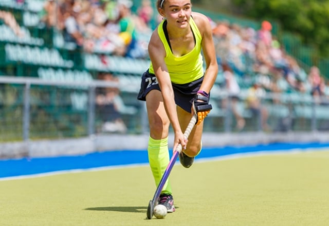 Girl playing hockey