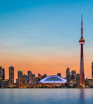 Skyline of Toronto over Ontario Lake at twilight