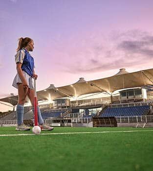 Hockey,,Stadium,And,Woman,Sports,Training,,Thinking,Of,Game,Strategy Hockey player in a training session at sunset