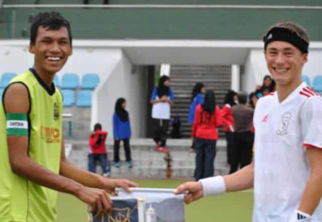 Team captains before a hockey game in Malaysia