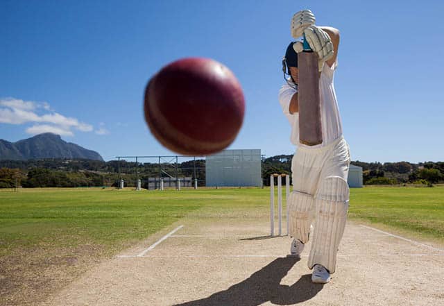 Cricket player hitting ball with bat in Cape Town