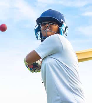 Female,Indian,Cricket,Player,Wearing,Protective,Gear,And,Hitting,The Teenage girl playing cricket