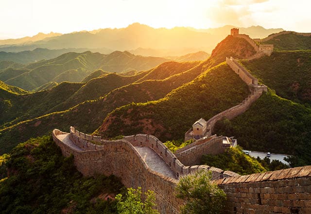 The stunning Great Wall of China bathed in golden light at sunset
