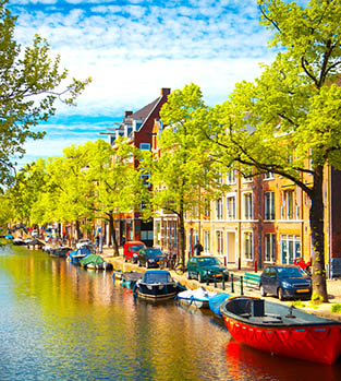 Colourful boats on the canals of Amsterdam