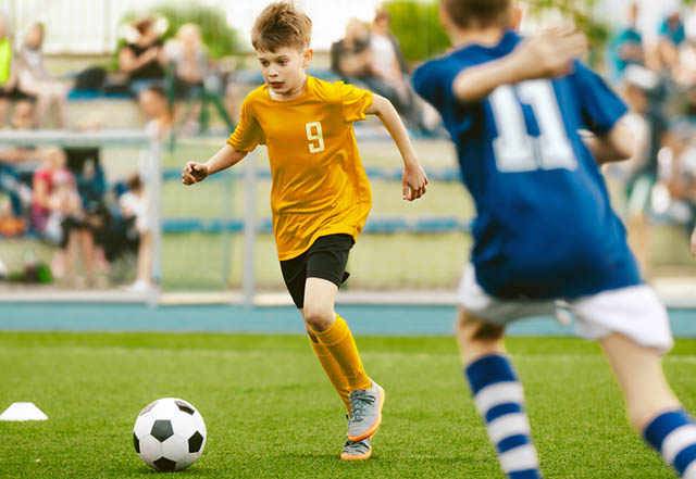Boys playing football