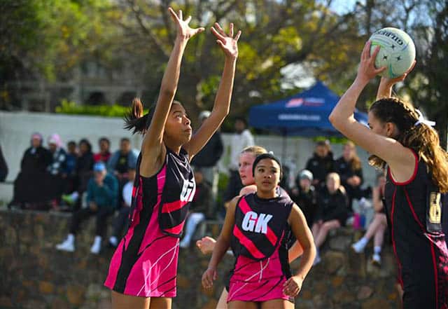 Girls playing netball on an Edwin Doran sports tour
