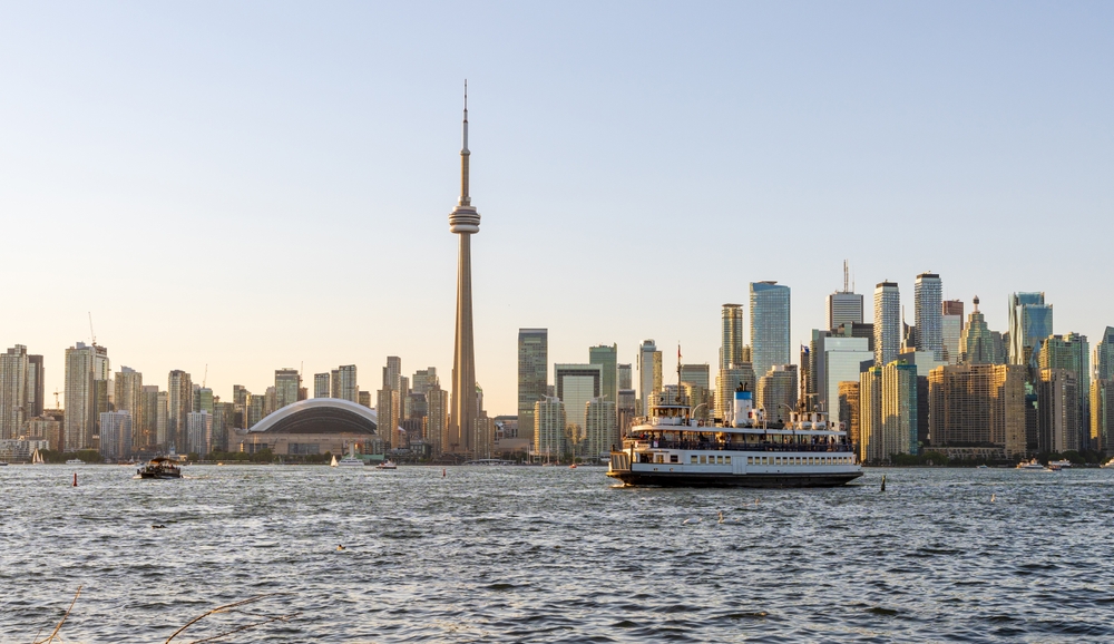 Toronto City Downtown Skyline At Sunset Time. Toronto Island Ferry