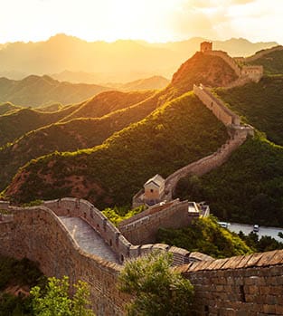 The stunning Great Wall of China bathed in golden light at sunset