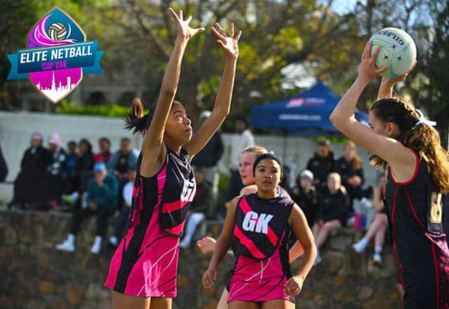 Girls playing netball on an Edwin Doran sports tour