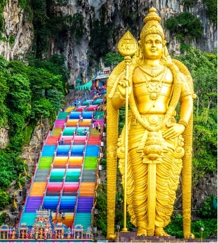 See the ornate Hindu shrines at the Batu Caves just outside of Kuala Lumpur