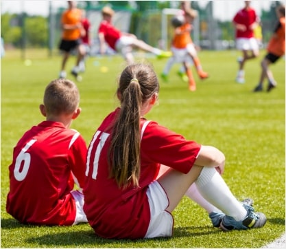 Young players waiting for their turn to play