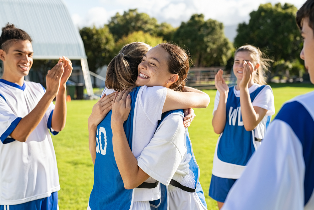 Football players hugging