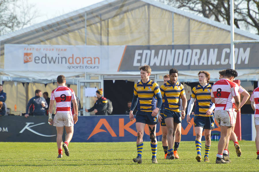 Rugby team on the pitch at Rosslyn Park, just outside the Edwin Doran tent