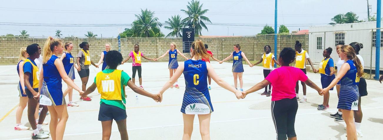 Netball girls forming a circle