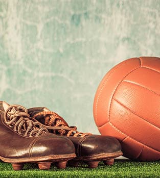 Retro football shoes and ball