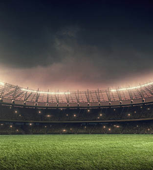 Football stadium lit up at night