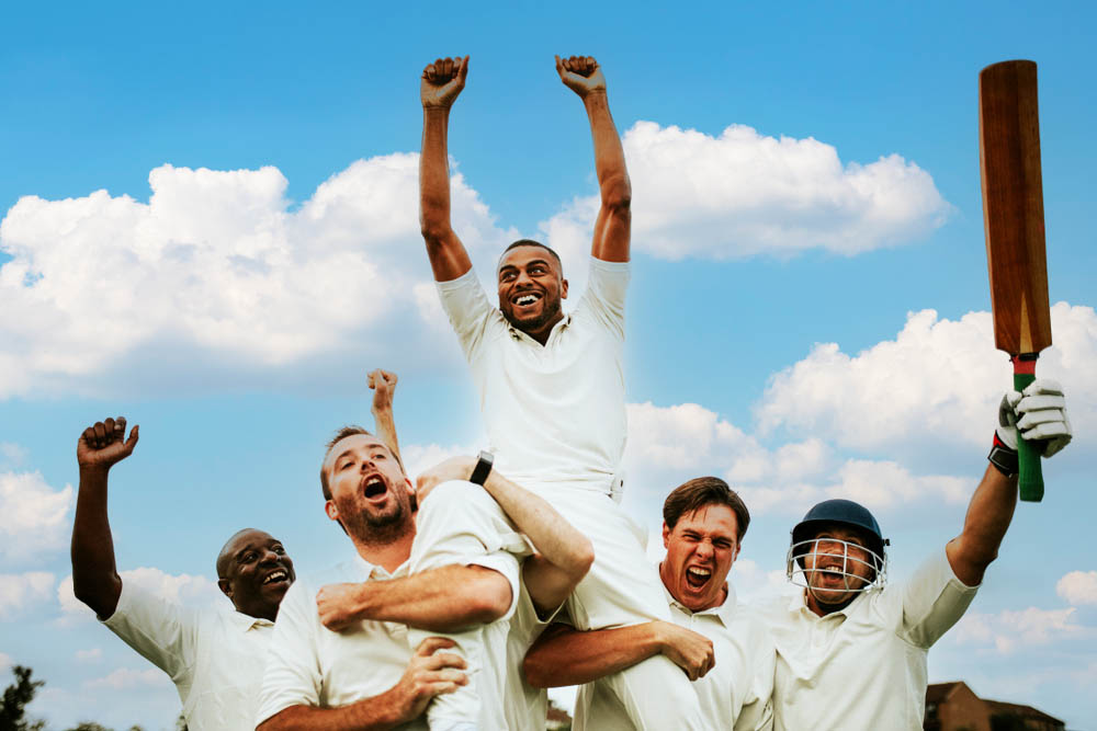 Cheerful cricketers celebrating their victory