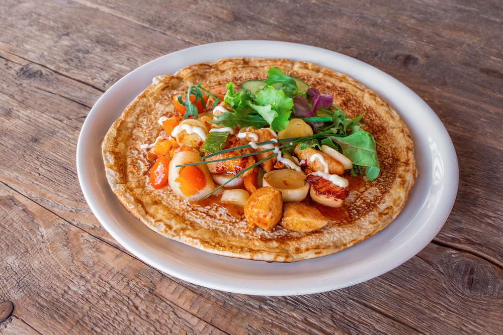 A plate of traditional savory Dutch pancake