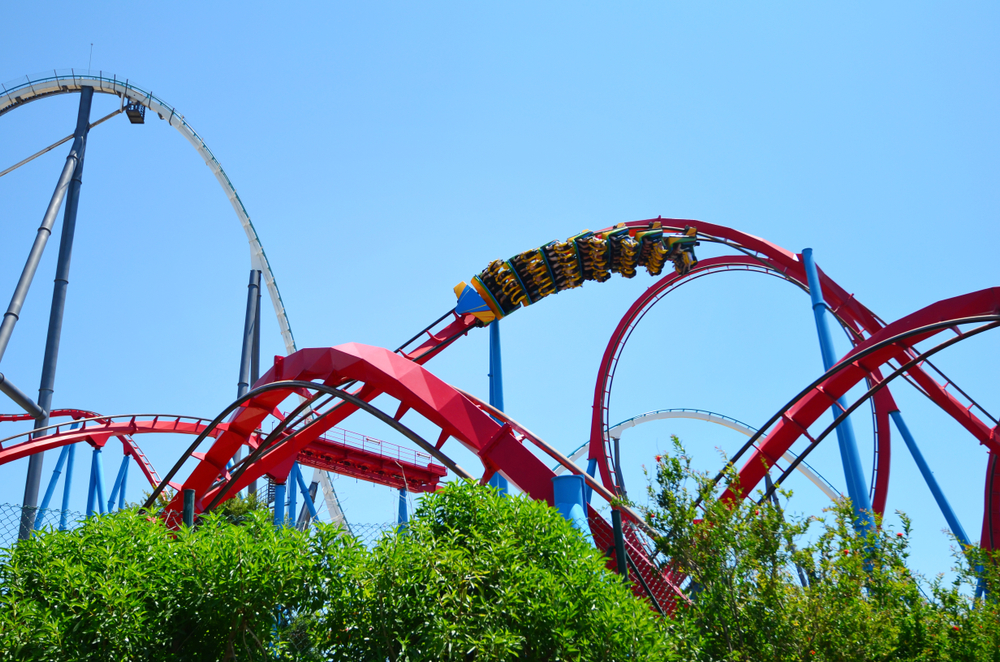 View of a big rollercoaster in Port Aventura in Spain against a blue sky background