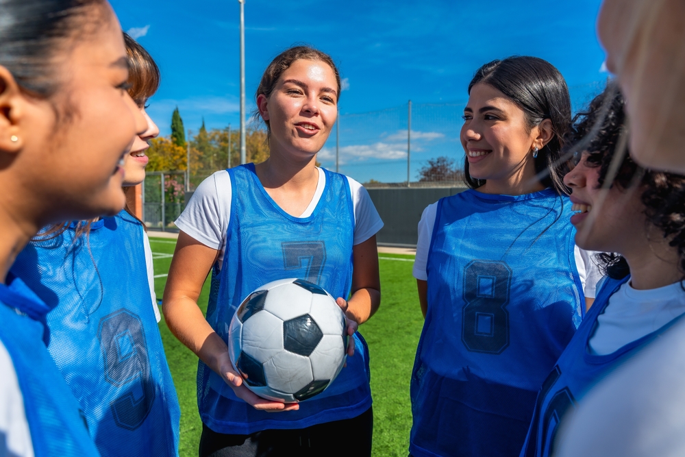 Football girls team talking before a match