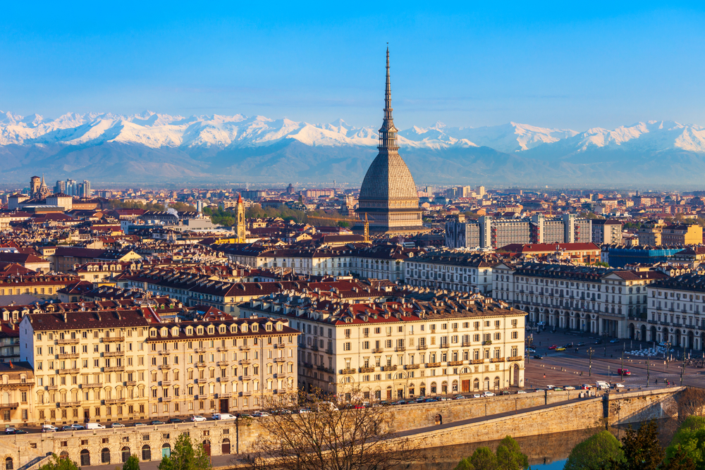 Aerial view of Turin with snowy peaks in the background