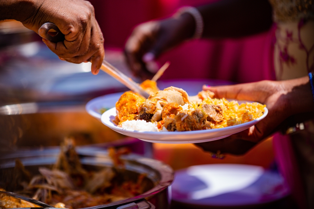 Person serving traditional Kenian food