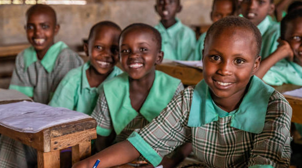 Kenian children wearing school uniforms in a classroom