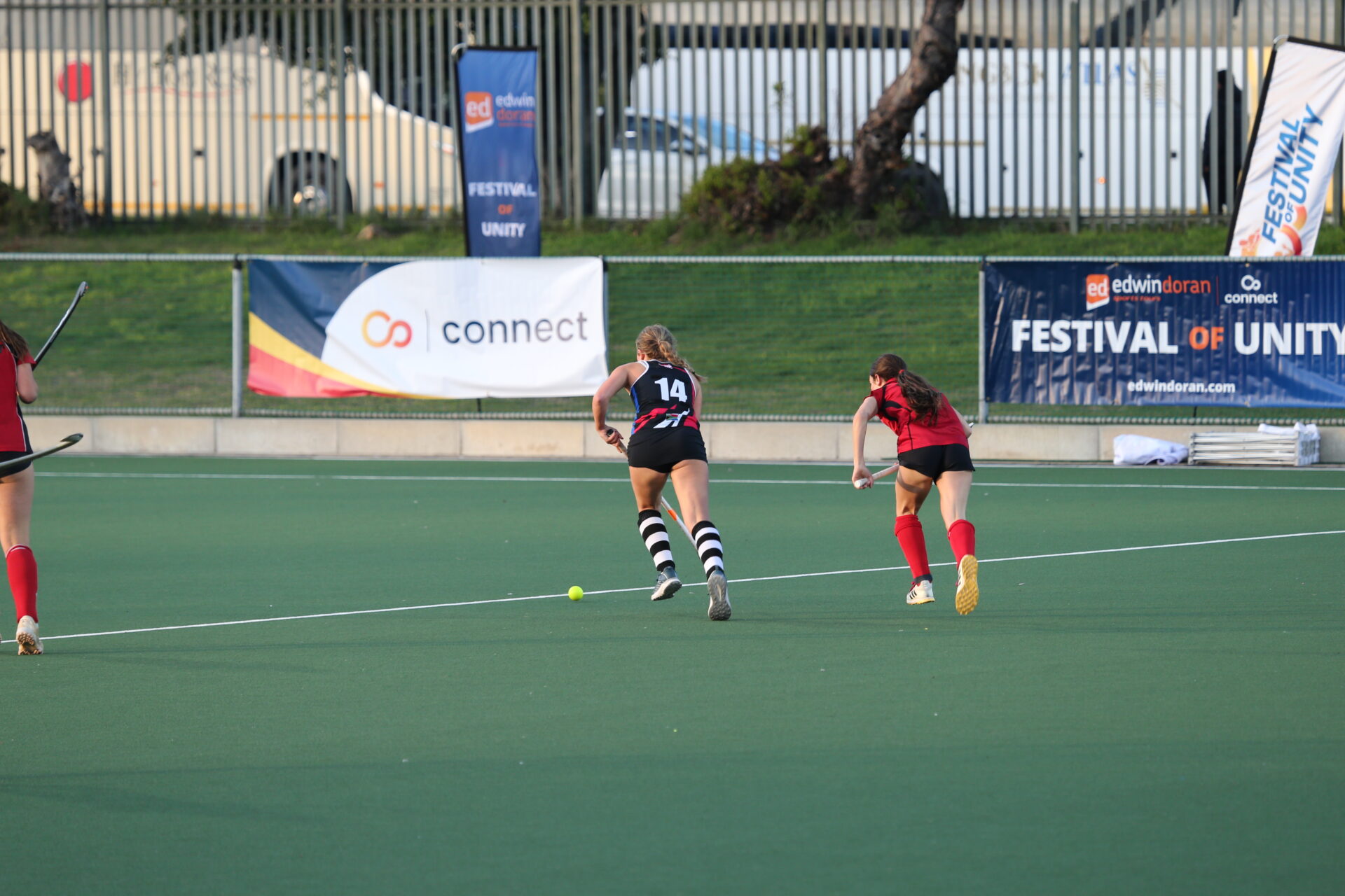 Girls playing hockey at the Festival of Unity in South Africa